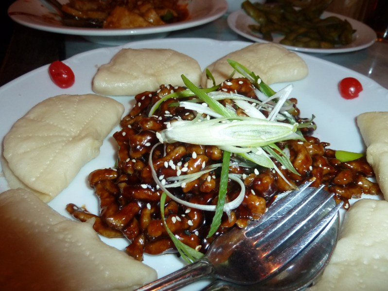 Hoi sin pork with steamed buns and spring onions