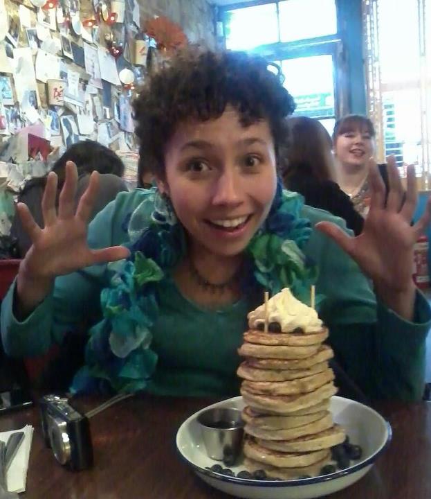 I cheerfully pose with pancakes, oblivious to the hardship I'm about to endure...