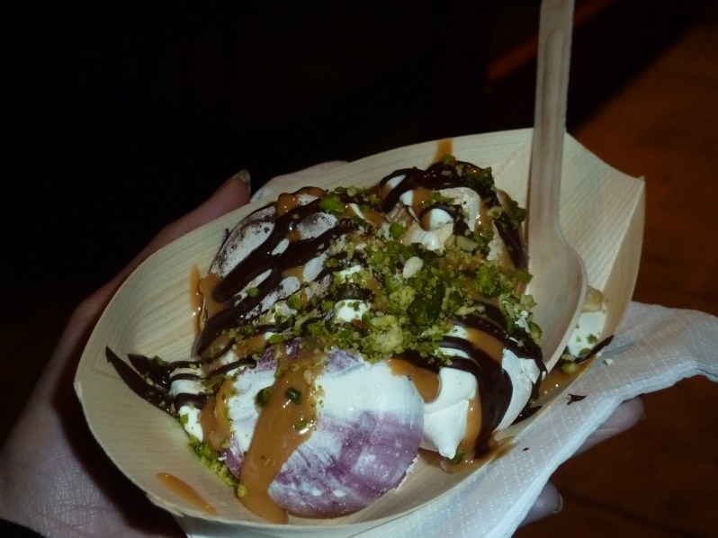 Meringues with chocolate sauce, salted caramel sauce, cream, pistachios and hazelnuts 