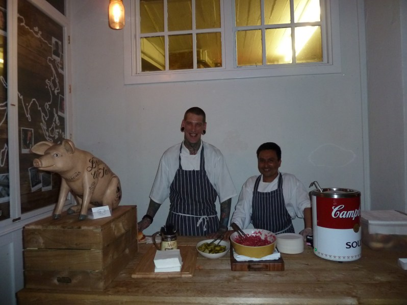 The boys ready to serve up delicious pulled pork...out of a giant Campbell's soup can!