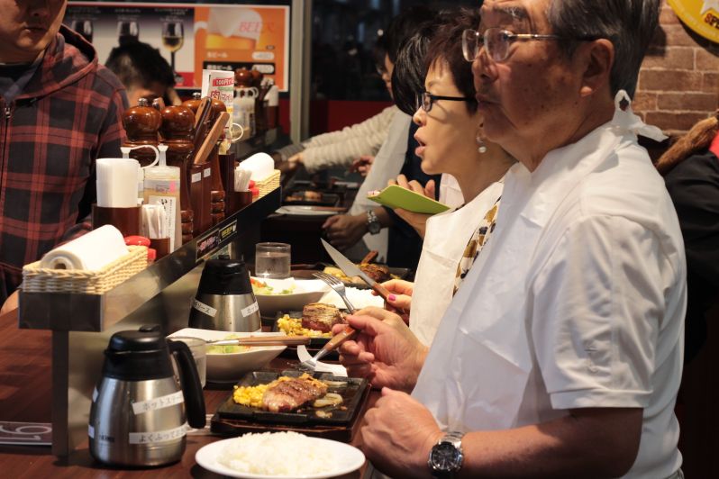 Customers enjoying their steaks